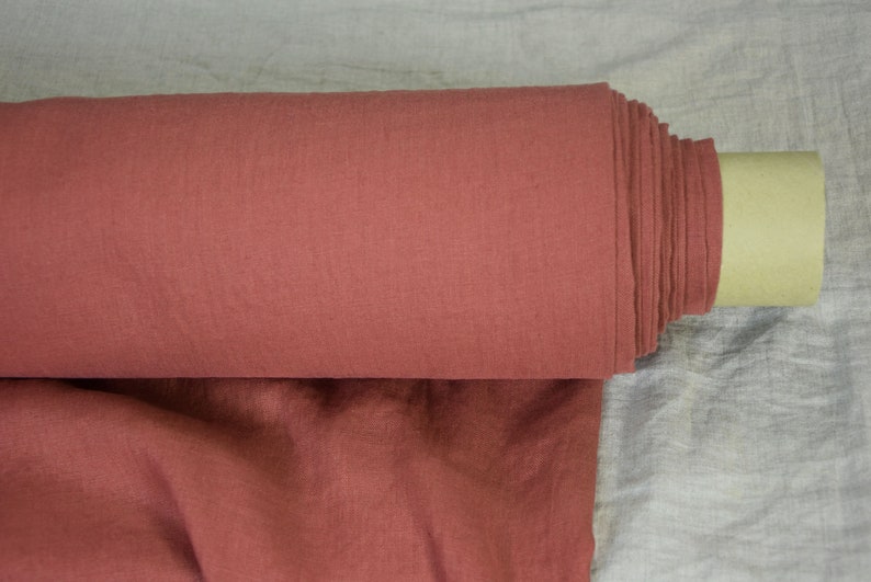 Pure linen fabric Gloria Red River Clay from LINENGRAPHY. This glamorous, deep, rare and original shade of red holds together brownish and purplish tones. Rich but not too bright. Middle weight, dense, not sheer, plain.