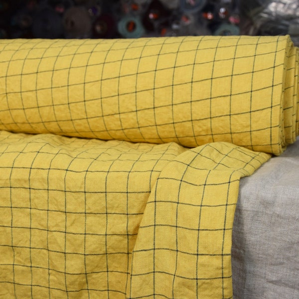 IN STOCK. 100% linen fabric Margarita Yellow Graph Check 195gsm (5.70oz/yd2). Dark blue grid pattern on yellow background. Washed-softened.