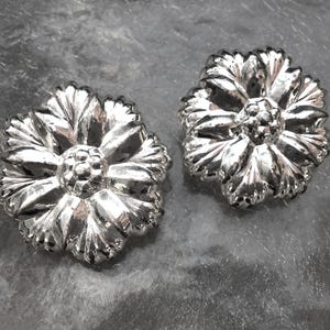 Nina Ricci Brilliant Silver Flower Clip Earrings