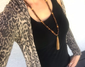 Wood mala and leather tassel necklace.