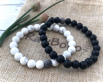 Men and women’s gemstone bracelets matte black onyx and white matte howlite beads.