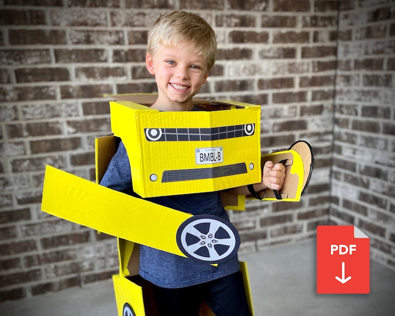 May include: A young boy wearing a cardboard costume of a yellow car. The costume has a black license plate that reads "BMBLB".