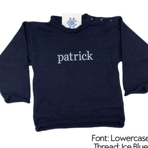 May include: A navy blue long-sleeved shirt with the name "patrick" embroidered in light blue thread. The font is lowercase.