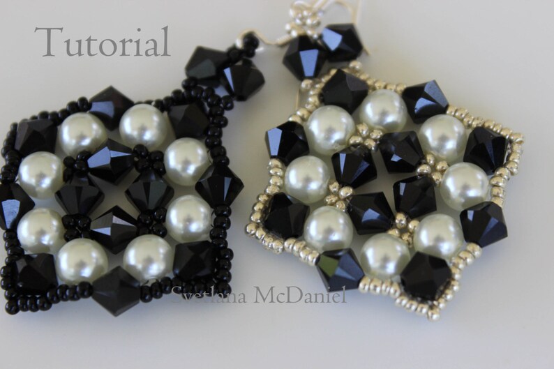 May include: Close-up of two handmade earrings. Each earring features a geometric design with black faceted beads and white faux pearls. The edges are outlined with small silver beads. The word "Tutorial" is visible in the image.