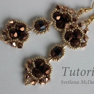 May include: A pair of gold and brown beaded earrings with a teardrop shape. The earrings feature a cluster of dark brown faceted beads and smaller gold beads. The earrings are hanging from gold hooks.