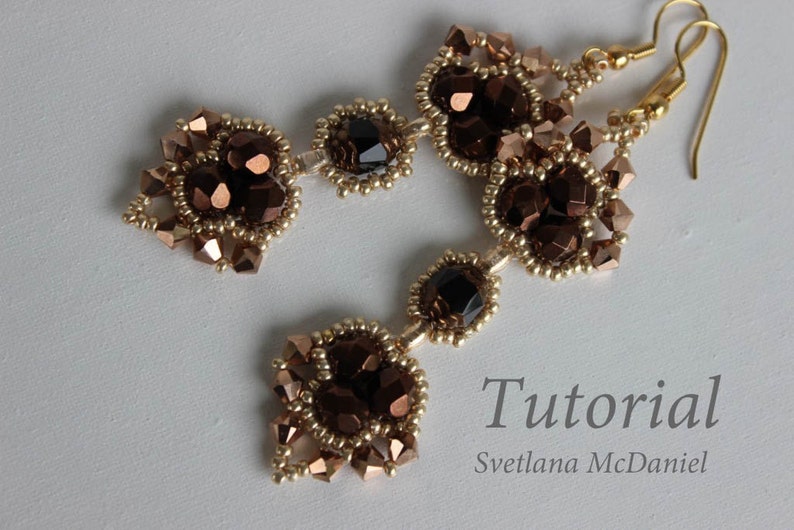 May include: A pair of gold and brown beaded earrings with a teardrop shape. The earrings feature a cluster of dark brown faceted beads and smaller gold beads. The earrings are hanging from gold hooks.