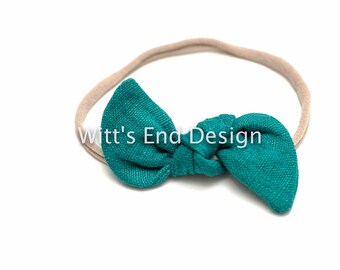 Hoofdband met smaragdgroene knoop - linnen strik op nylon of clip