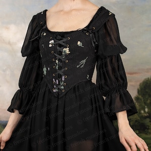 Black Chiffon Long Sleeve Chemise featuring floral embroidered bodice with lace-up front and puffy sleeves in sheer black fabric