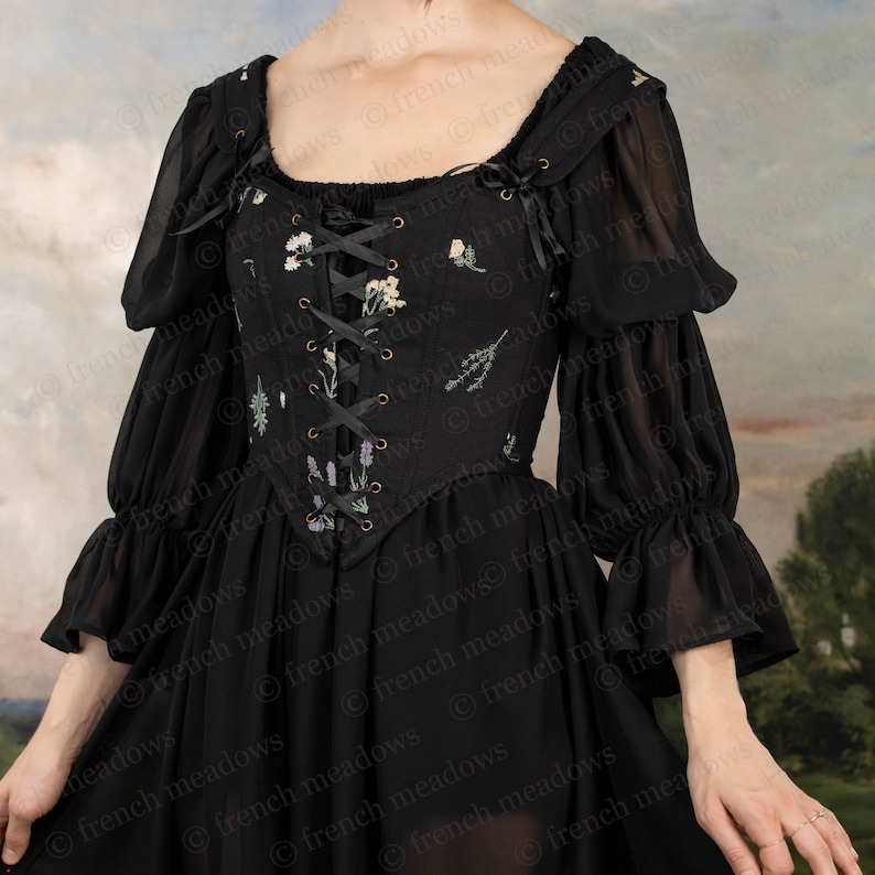 Black Chiffon Long Sleeve Chemise featuring floral embroidered bodice with lace-up front and puffy sleeves in sheer black fabric