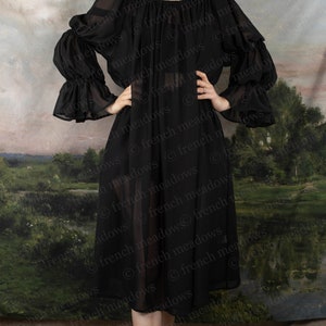 Black Chiffon Long Sleeve Chemise with flowing ruffled sleeves and elastic neckline, shown against pastoral landscape backdrop