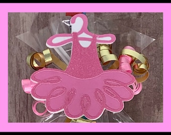 Op de afbeelding: Roze glitter ballerina jurk feestbevoorrading met gouden en roze krulband.