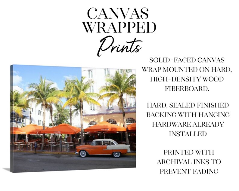 May include: A vintage orange car parked in front of a cafe with orange umbrellas. The cafe is located in a tropical setting with palm trees and a white building. The image is a canvas print with a solid-faced canvas wrap mounted on hard, high-density wood fibreboard. The print has a hard, sealed finished backing with hanging hardware already installed. It is printed with archival inks to prevent fading.