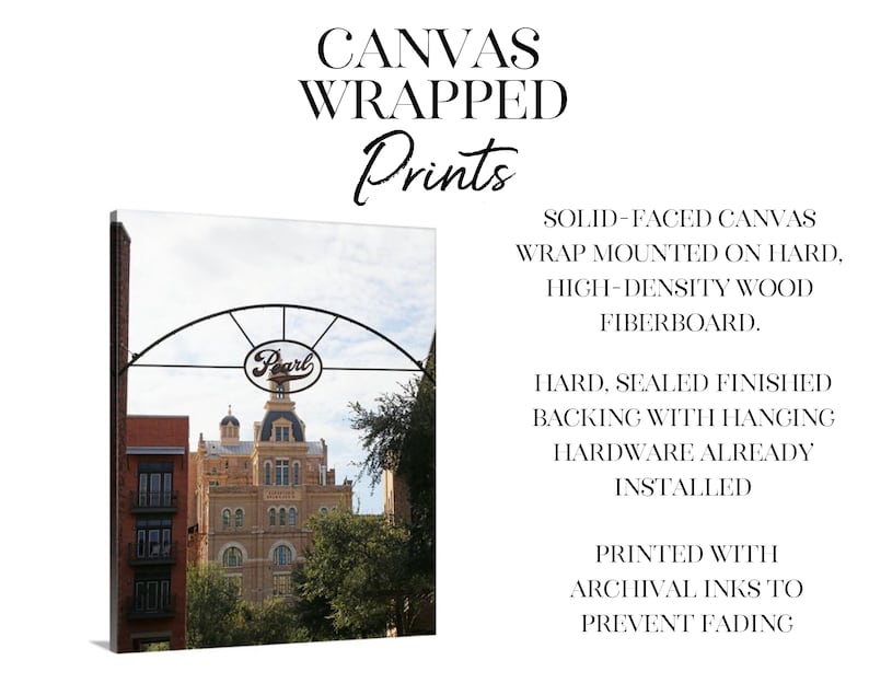 May include: Canvas print of a building with a sign that says "Pearl" above it. The building is a light brown color with many windows. The sign is a black metal arch with the word "Pearl" in white letters. The print is mounted on a hard, high-density wood fiberboard.