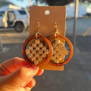 May include: A rustic wooden sign with the text "Welcome to our home" in white lettering. The sign features a distressed finish and a simple, inviting design, perfect for entryway decor.