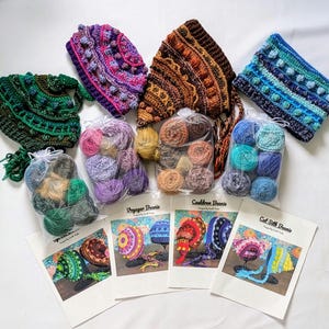 May include: Five crochet beanie hat patterns with yarn and instructions. The patterns are called Voyager Beanie, Cauldron Beanie, and Cat Silk Beanie.