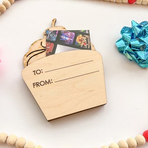May include: A wooden cupcake-shaped gift tag with a photo insert and space to write "To:" and "From:".