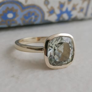 Green Amethyst Statement Ring Natural Stone Crystal Cushion Cut Design Sterling Silver Band Yellow Gold Plated Bezel Setting Handpicked Gemstone Quality Premium Jewelry Collection Special Occasion Piece Elegant Statement Accessory Beautiful