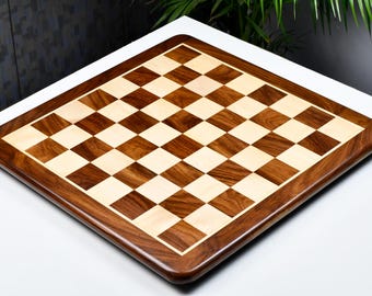 May include: A wooden chessboard with a dark brown and light wood checkered pattern. The board has a rounded edge and is made of high-quality wood.