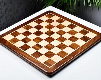 May include: A wooden chessboard with a dark brown and light wood design. The board has a smooth, polished finish.