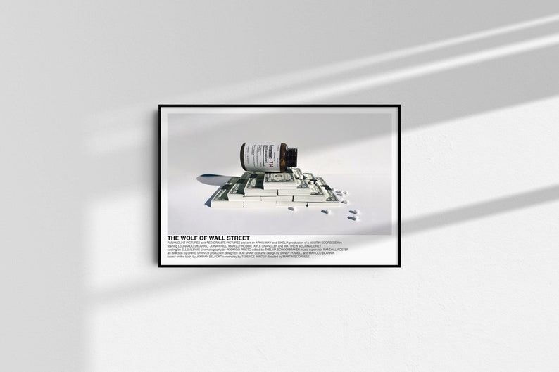 May include: A black and white poster with the title "The Wolf of Wall Street" and an image of a bottle of pills spilling onto a stack of dollar bills.
