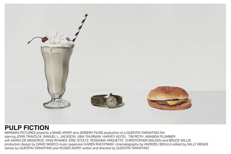 May include: A movie poster for Pulp Fiction, a Quentin Tarantino film. The poster features a milkshake, a hamburger, and a wristwatch on a white background. The title "Pulp Fiction" is written in black text at the bottom of the poster.