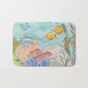 May include: A watercolor painting of a colorful underwater scene with blue, red, yellow, and orange fish swimming around coral and seaweed. Two seahorses are also visible in the painting.