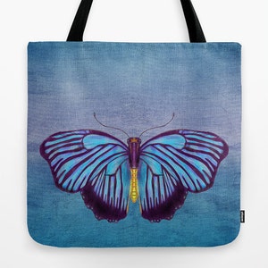 May include: A tote bag with a blue and purple butterfly design on a blue background.
