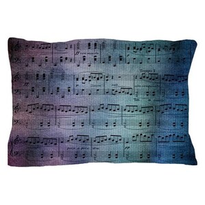 May include: A pillow featuring a vintage sheet music design with a blue, purple, and green color scheme. The music notes are black and the text on the sheet music reads "Tempo 1" and "alla conpagnia semplice".
