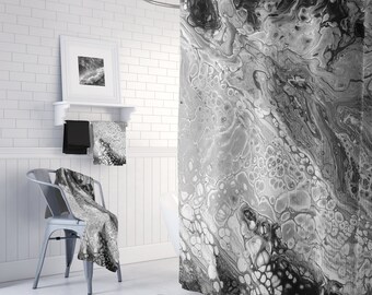 May include: Black and white shower curtain with a marbled design. The curtain features a swirling pattern of gray and black with white accents.