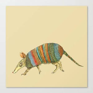 May include: A colorful armadillo with a multi-colored shell, including shades of green, blue, orange, and red, is walking on a light yellow background.