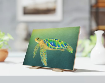 May include: A green and gold sea turtle with a blue shell swims in a green ocean. The turtle is painted on a canvas with a wood frame.