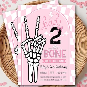 May include: A rectangular birthday invitation card featuring a pink and white checkered background. The card displays a black skeleton hand making a peace sign, the text "bad 2 the BONE", and details for Riley's 2nd Birthday on October 15th.