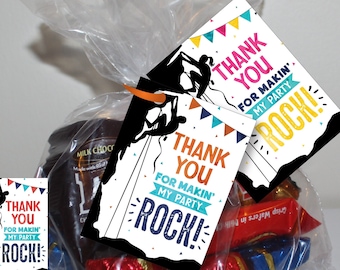 May include: Thank you for making my party rock! Printable favor tags with a rock climbing theme. The tags are black with white text and colorful accents. The tags are 8.5 x 11 inches and can be printed on a sheet of paper.