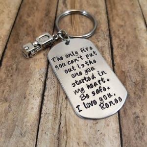 May include: Silver keychain with a truck charm and a tag that reads "The only fire you can't put out is the one you started in my heart. Be safe. I love you, Renee."