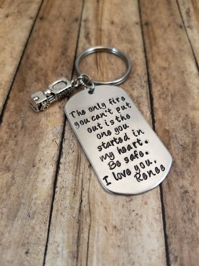 May include: Silver keychain with a truck charm and a tag that reads "The only fire you can't put out is the one you started in my heart. Be safe. I love you, Renee."
