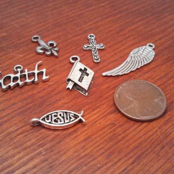 Add on a metal charm, bible, cross, fleur de lis, angel wing, peace, cancer ribbon, horse shoe, heart, volleyball, baseball, football, gun