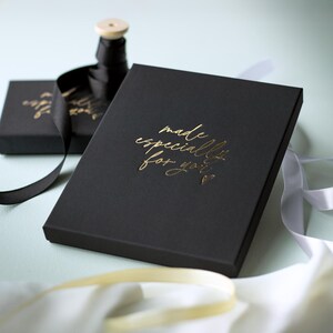 a black box with gold text that reads "made especially for you" on a white background.