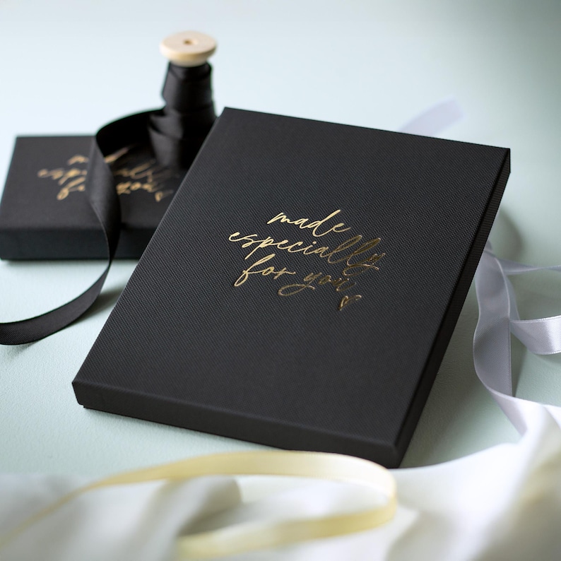 a black box with gold text that reads "made especially for you" on a white background.