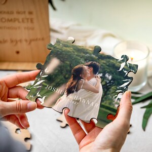 Detailed view of the interlocking laser-cut wooden jigsaw pieces on the UV-printed wooden photo wedding guest book alternative, highlighting the smooth signing surface for guest messages.