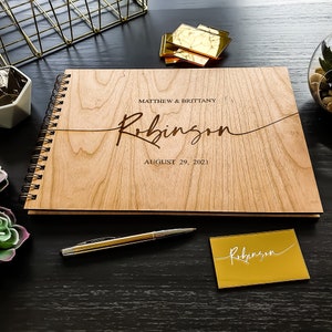 Alternative wedding guest book with this personalized wood engraved guestbook. This rustic wedding décor feature a custom wooden guestbook, and wedding table décor. Wedding sign and confetti, this wedding planner book is from Secret Creation Ltd