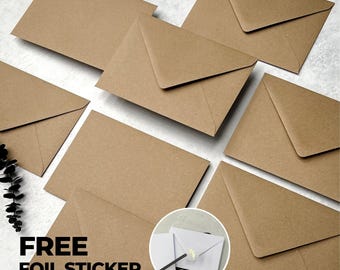 May include: A collection of rectangular brown kraft paper envelopes arranged in a scattered pattern. A circular inset shows a white envelope sealed with a small gold foil sticker. The text FREE FOIL STICKER is printed in bold black letters.