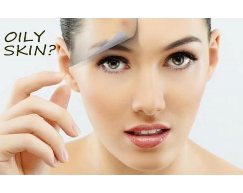 May include: A close-up of a face with a translucent film being peeled back from the forehead to reveal smoother skin underneath. The text OILY SKIN? is printed in black on the left side. The person has brown eyes and natural-toned lips.