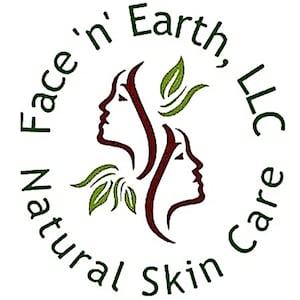May include: A circular logo design featuring two stylized profiles of faces in dark red, surrounded by green leaves. The text Face 'n' Earth, LLC and Natural Skin Care is written in dark green lettering in a circular arc around the central graphic.