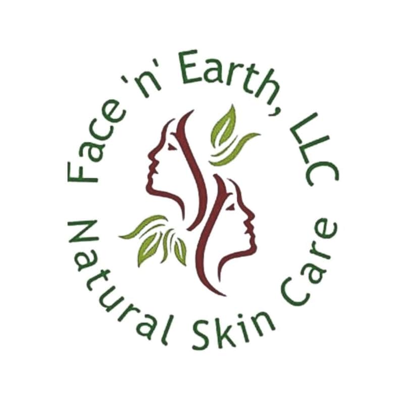 May include: A circular logo featuring the text Face 'n Earth, LLC Natural Skin Care in dark green. The center displays two stylized profiles of faces in dark red, accented by two green leaf illustrations positioned above and below the profiles.