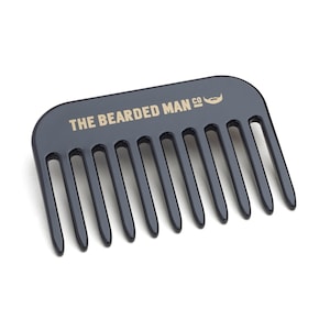 May include: Black plastic comb with the text "THE BEARDED MAN CO" and a small beard icon in gold lettering.