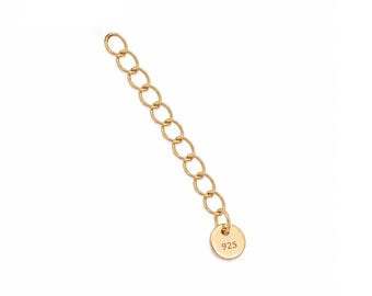 May include: Gold-coloured chain extender with oval links and a small round tag. The tag is stamped with the number "925". The extender is designed to lengthen necklaces or bracelets.