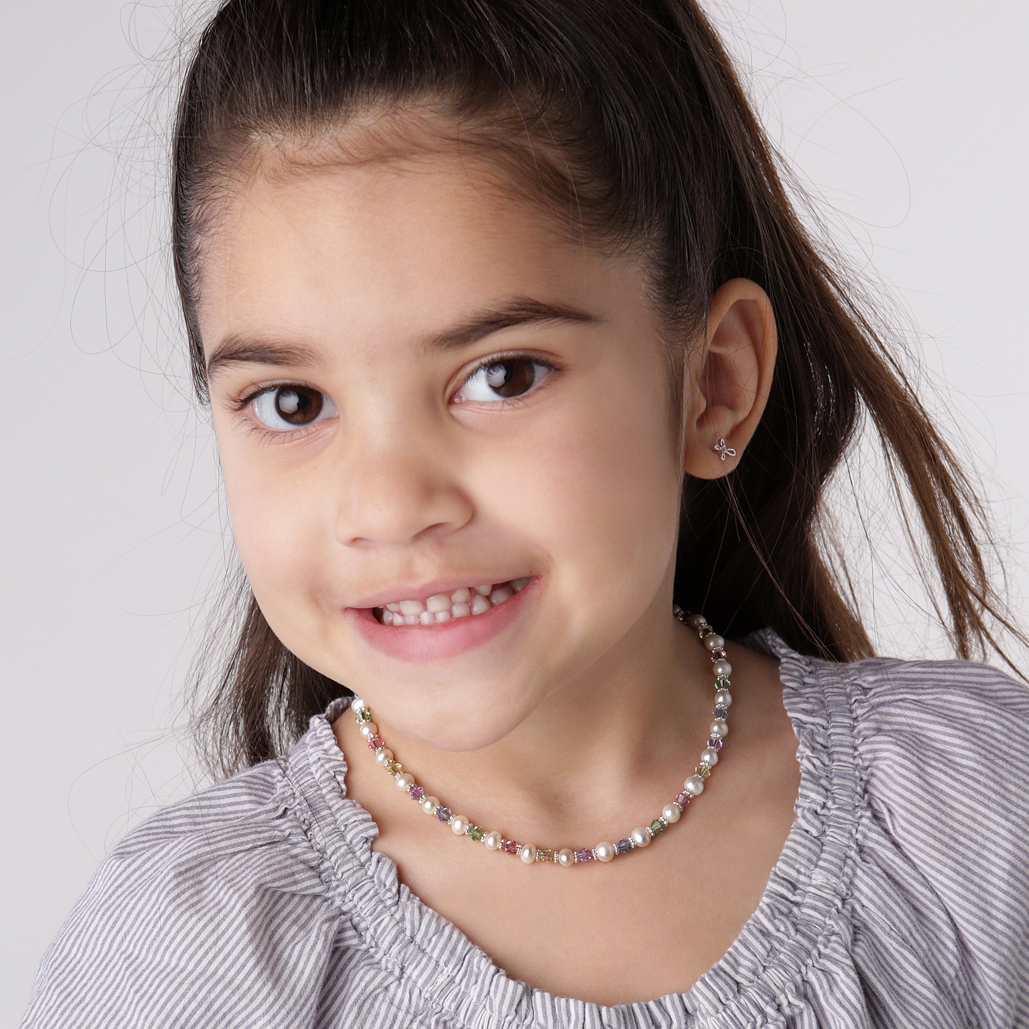 Asian Little Girl With A Pearl Necklace