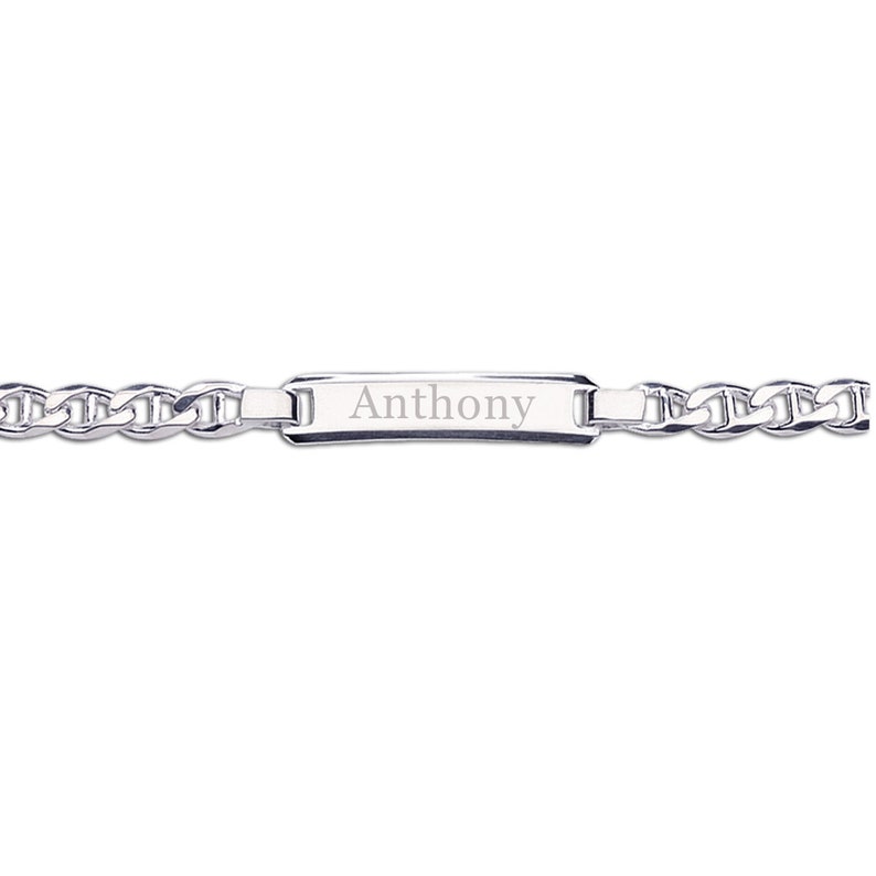 Sterling silver ID bracelet lying flat showing link detail and name personalization engraving.