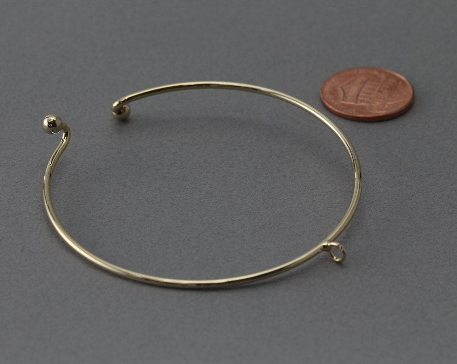 Bracciale rigido in oro massiccio: cinturino regolabile con filo