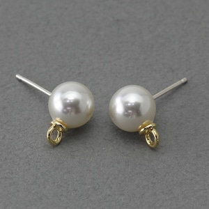 May include: A pair of pearl stud earrings. Each earring features a white, spherical pearl with a gold-colored loop and a silver post. The earrings are set against a gray background.